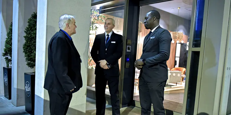 Security Guards welcoming a hotel guest