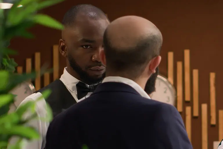 A hotel staff member dealing with a hotel guest after a security incident